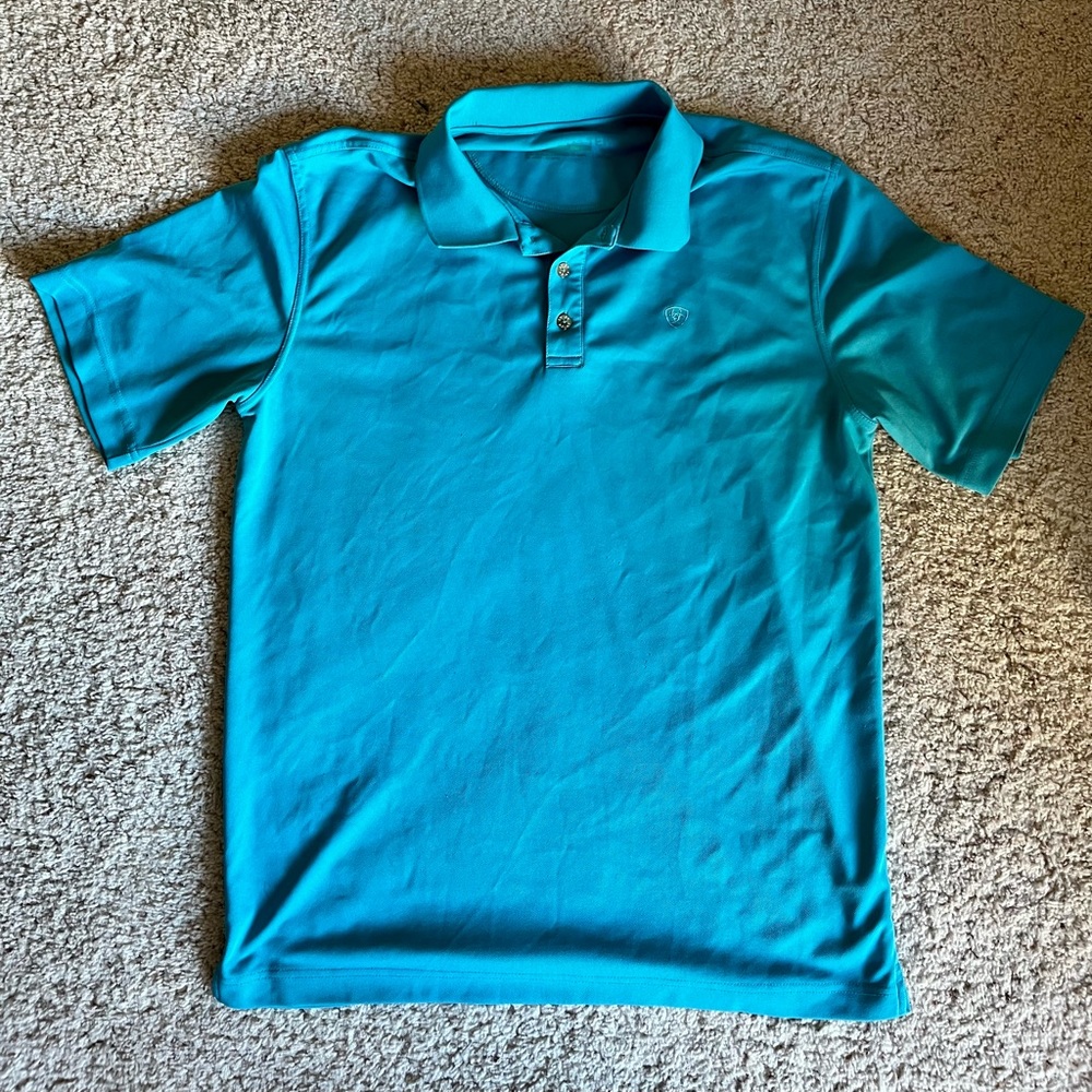 Women's beautiful aqua blue Ariat Tek polo shirt. Fabric is breathable.